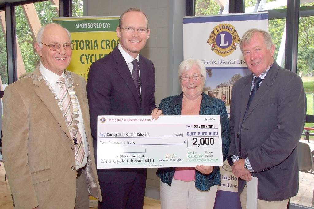 Pictured at the Presentation of Cheques from the Proceeds of the Carrigaline & Districts Lions Club Annual Charity Cycle, were from left, Patrick Coughlan, Club President ; The Minister for Agriculture ; Food ; Defence & The Marine, Simon Coveney, TD ; Agnes O'Reilly, Carrigaline Senior Citizens Day Care Centre and Mark Ginn, Cycle Classic Co-Ordinator. (Picture: Adrian OHerlihy) June 22nd 2015