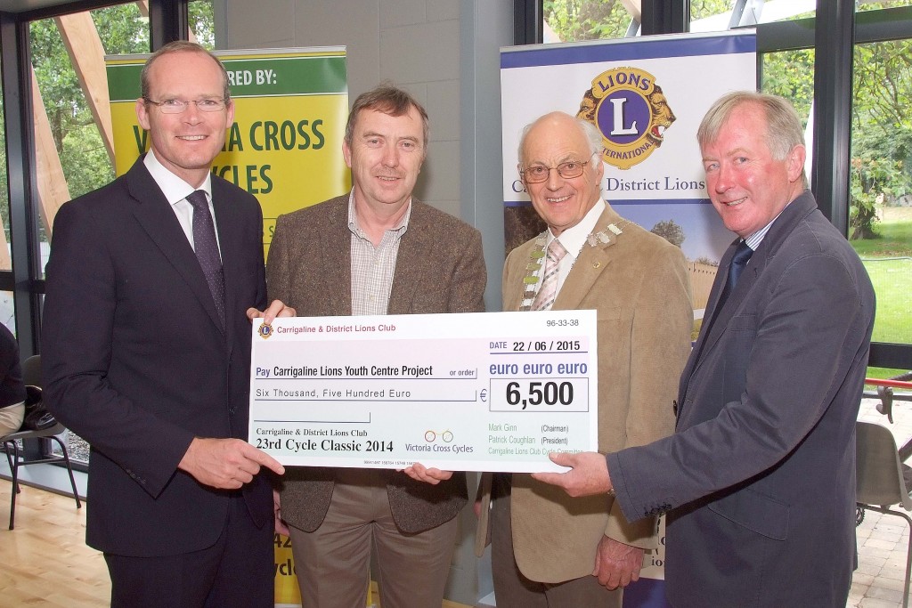 Pictured at the Presentation of Cheques from the Proceeds of the Carrigaline & Districts Lions Club Annual Charity Cycle, were from left, The Minister for Agriculture ; Food ; Defence & The Marine, Simon Coveney, TD ; Sean Duggan, Chairman,  Carrigaline Youth Centre Project ; Patrick Coughlan, Club President and Mark Ginn, Cycle Classic Co-Ordinator. (Picture: Adrian OHerlihy) June 22nd 2015