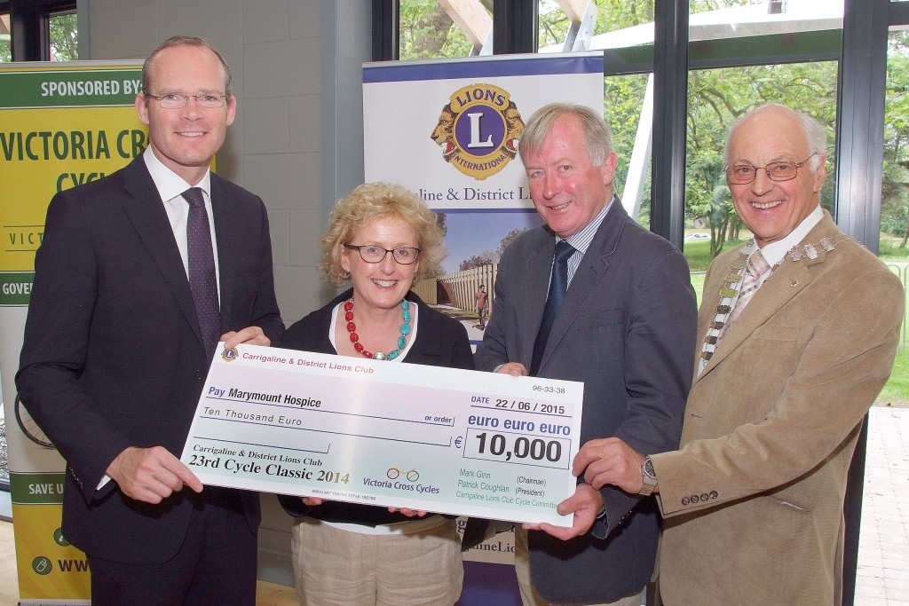 Pictured at the Presentation of Cheques from the Proceeds of the Carrigaline & Districts Lions Club Annual Charity Cycle, were from left, The Minister for Agriculture ; Food ; Defence and the Marine, Simon Coveney, TD ; Dr. Marie Murphy, Marymount Hospice ; Mark Ginn, Cycle Classic Co-Ordinator and Patrick Coughlan, Club President. (Picture: Adrian OHerlihy) June 22nd 2015