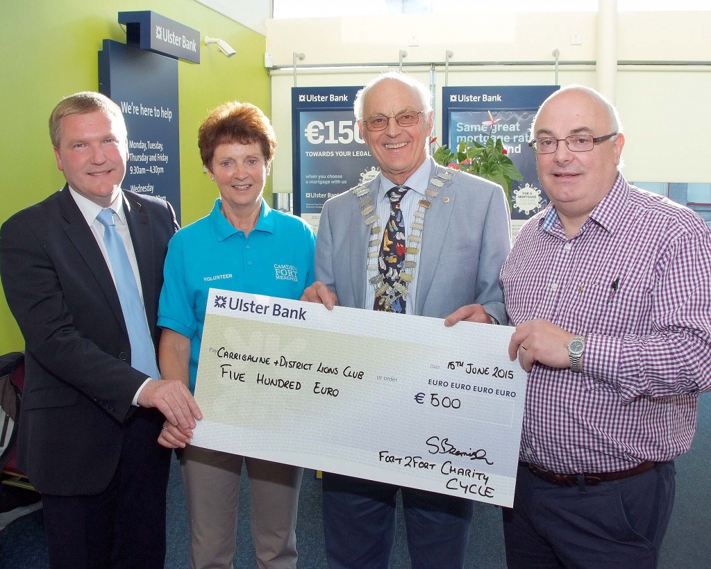 Pictured at the Presentation of cheques from the proceeds of the Fort2Fort Charity Cycle around Cork Harbour, were members of the Carrigaline & District Lions Club, Michael McGrath, TD ; Patrick Coughlan, Club President and Kieran McNamee with Eileen Murphy, Fort2Fort Cycle Committee. (Picture: Adrian OHerlihy) NO REPRODUCTION FEE  16-6-15