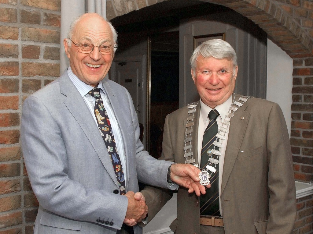 Patrick Coughlan, Immediate Past President, handing over the Presidential Chain of Office to the Incoming President of Carrigaline & District Lions Club, Roy Jolly. (Picture:Adrian O'Herlihy)