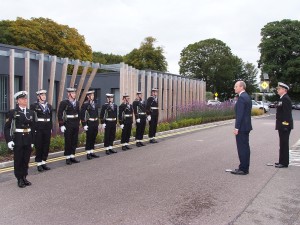 The Minister for Defence ; Marine ; Food & Agriculture, Simon Coveney, TD, pictured with a Guard of Honour from the Irish Navy, before he performed the Official Opening of the Carrigaline Lions Club Youth Centre. (Picture: Adrian O'Herlihy) Sept 18th 2015